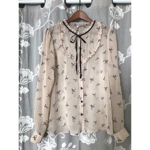 Sheer bird print tie neck blouse
